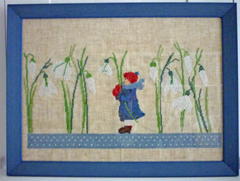 Auf Leinen gestickt und in Holz gerahmt